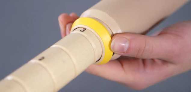 a hand adjusting a table leg