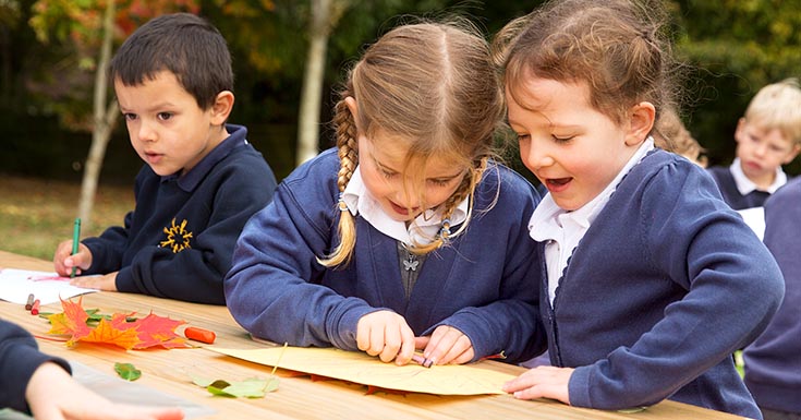 Children working at an outlast table