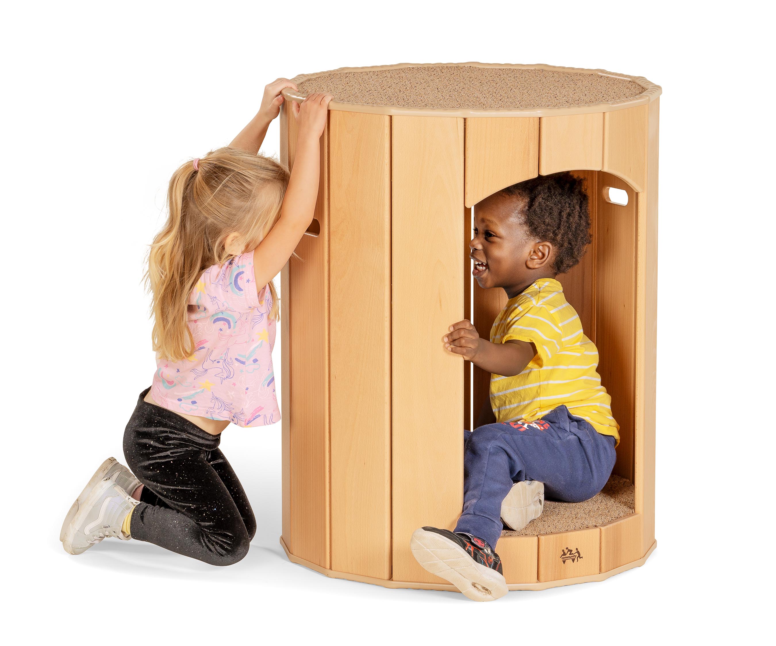 A toddler boy and girl laughing together and peeking at each other through the handhold of a Hollow Nook