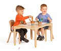 Two boys sitting in Woodcrest chairs doing mark-making at table