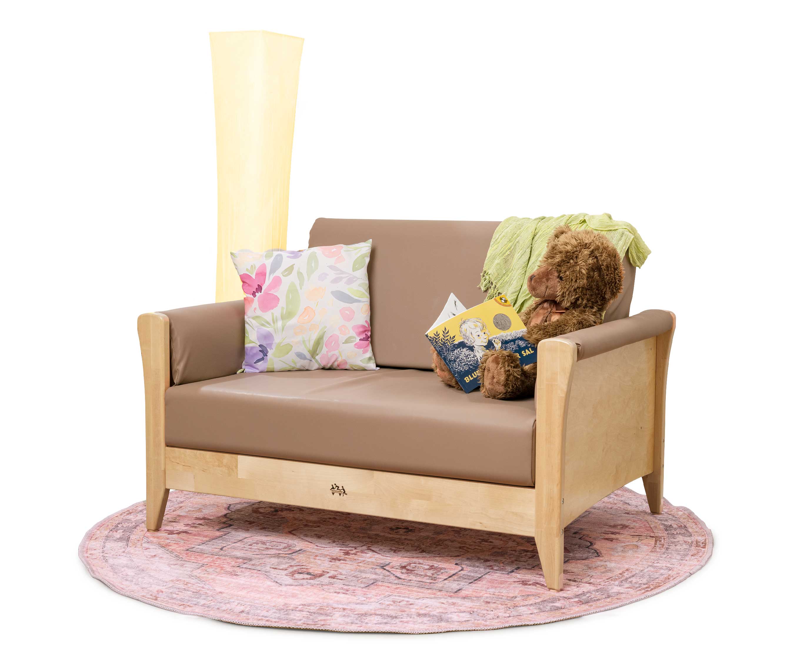 Nursery sofa with mocha-coloured cushions, and propped with a toy fox