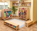 A welcome area with two benches, a mobile coat trolley and a mobile welly storage unit
