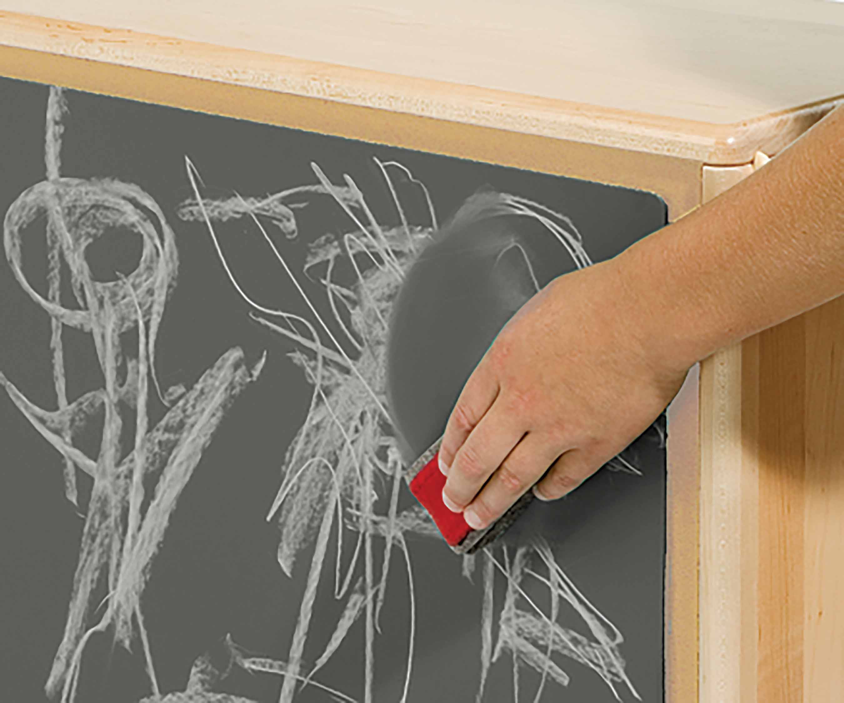 A chalkboard cover with chalk marks is attached to a shelf back