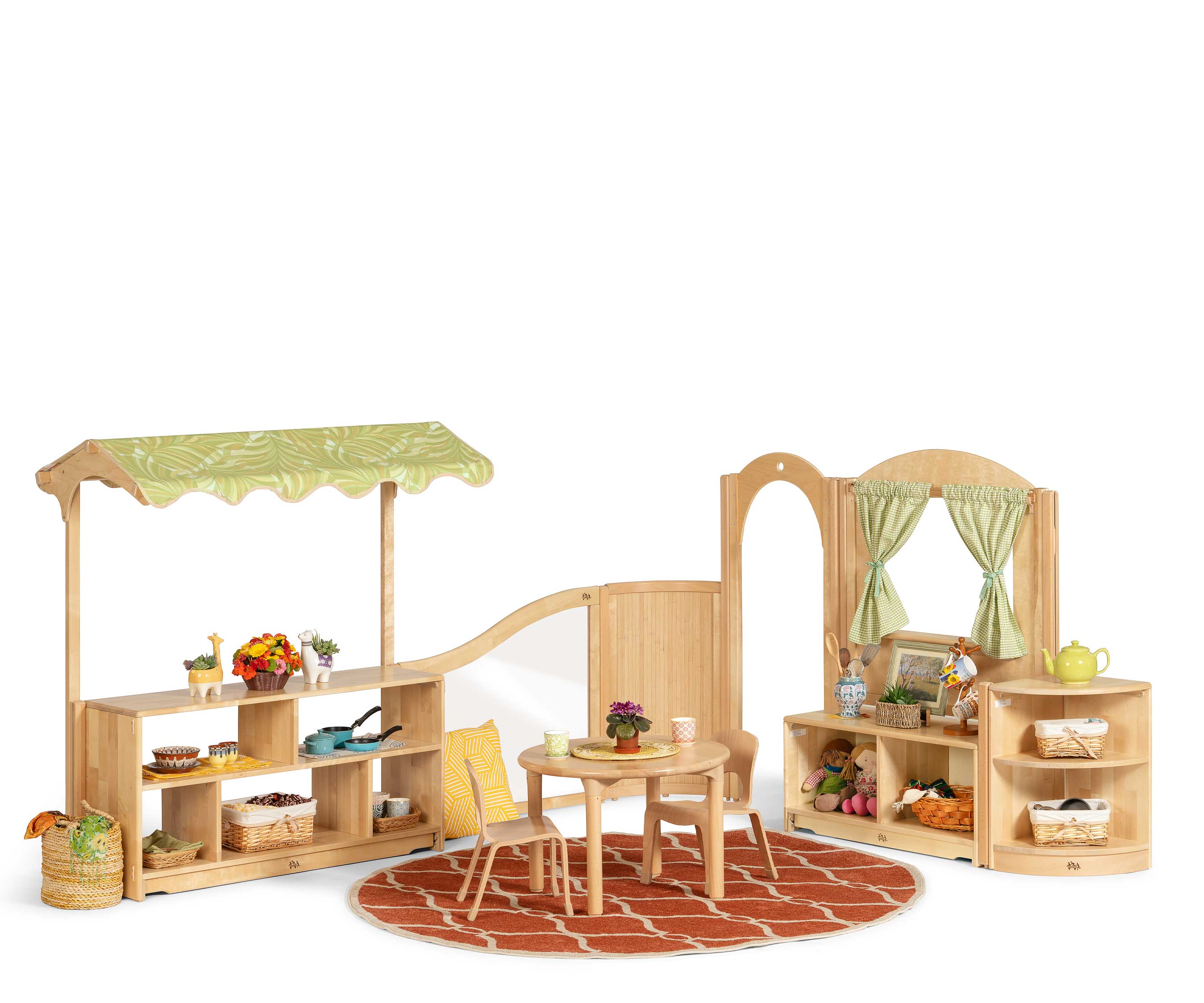 Classroom role play area set up with a table and chairs and toys