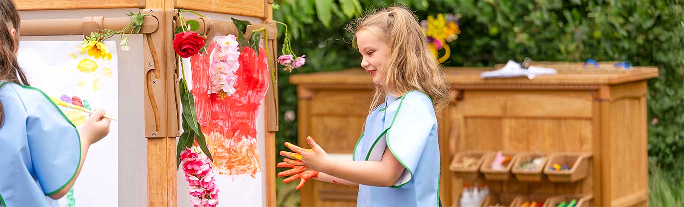 Children painting on the Outlast Easel