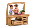 Two girls play with a mud kitchen sink for toddlers