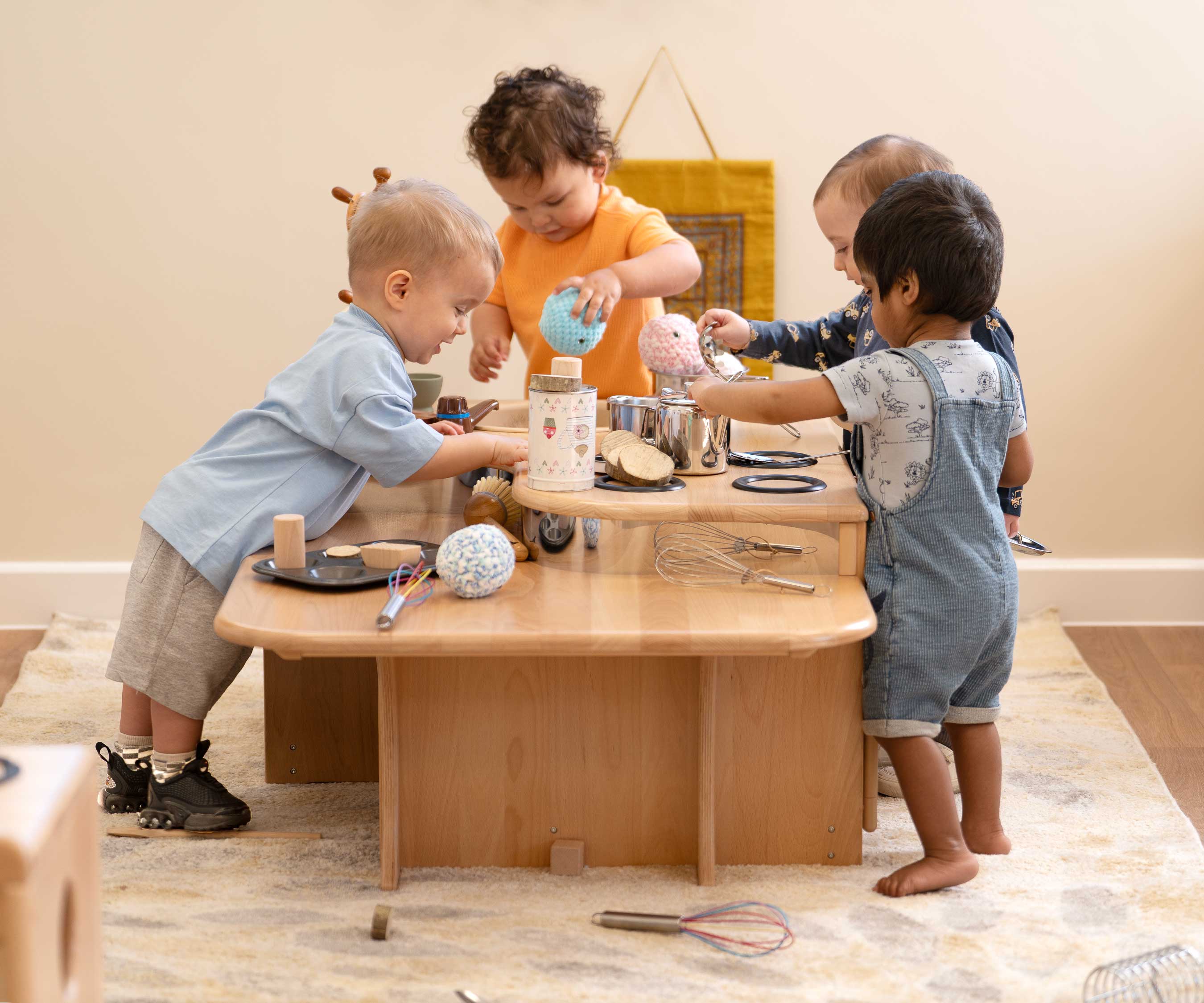 4 kids by low kitchen island