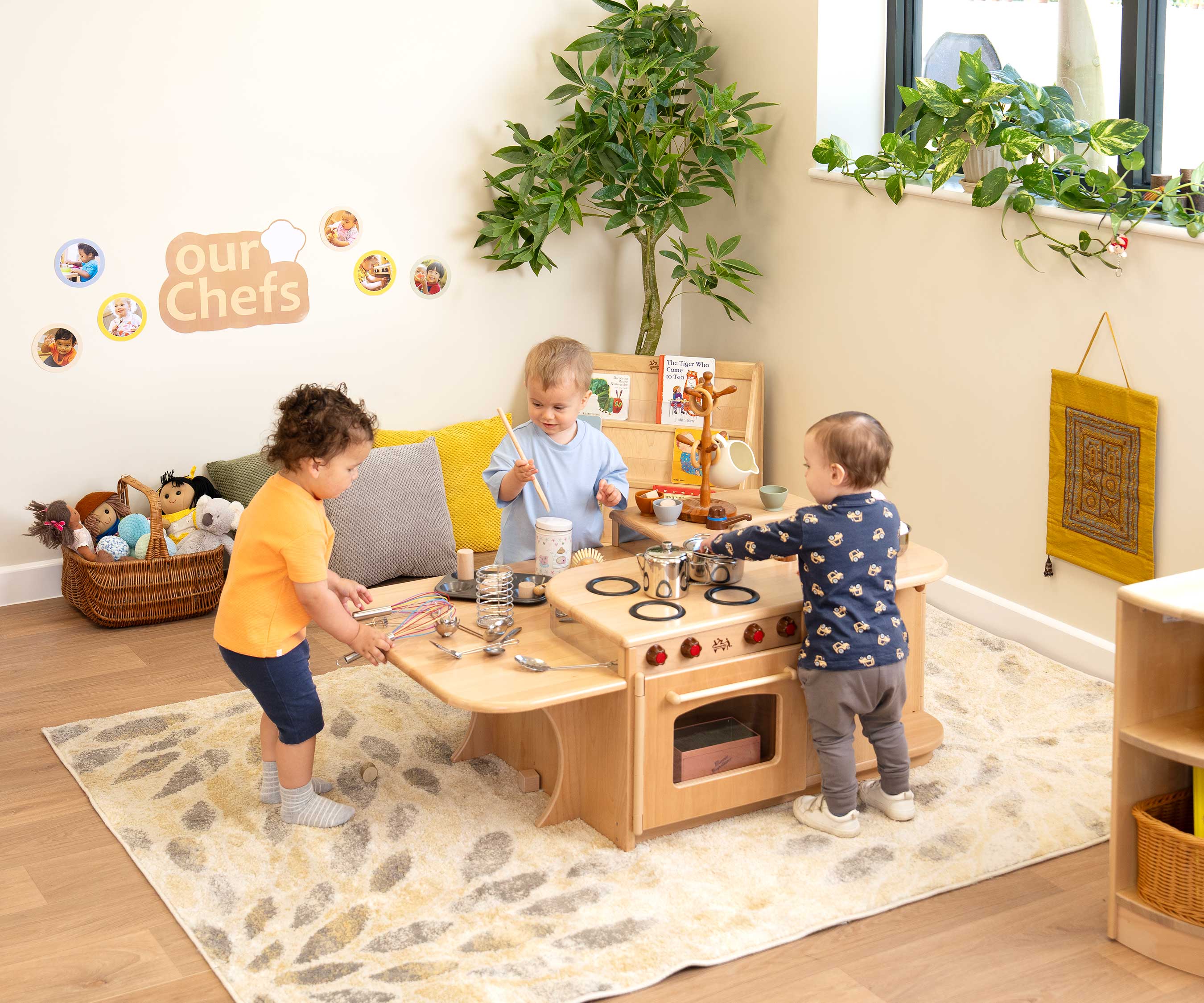 3 kids by low kitchen island