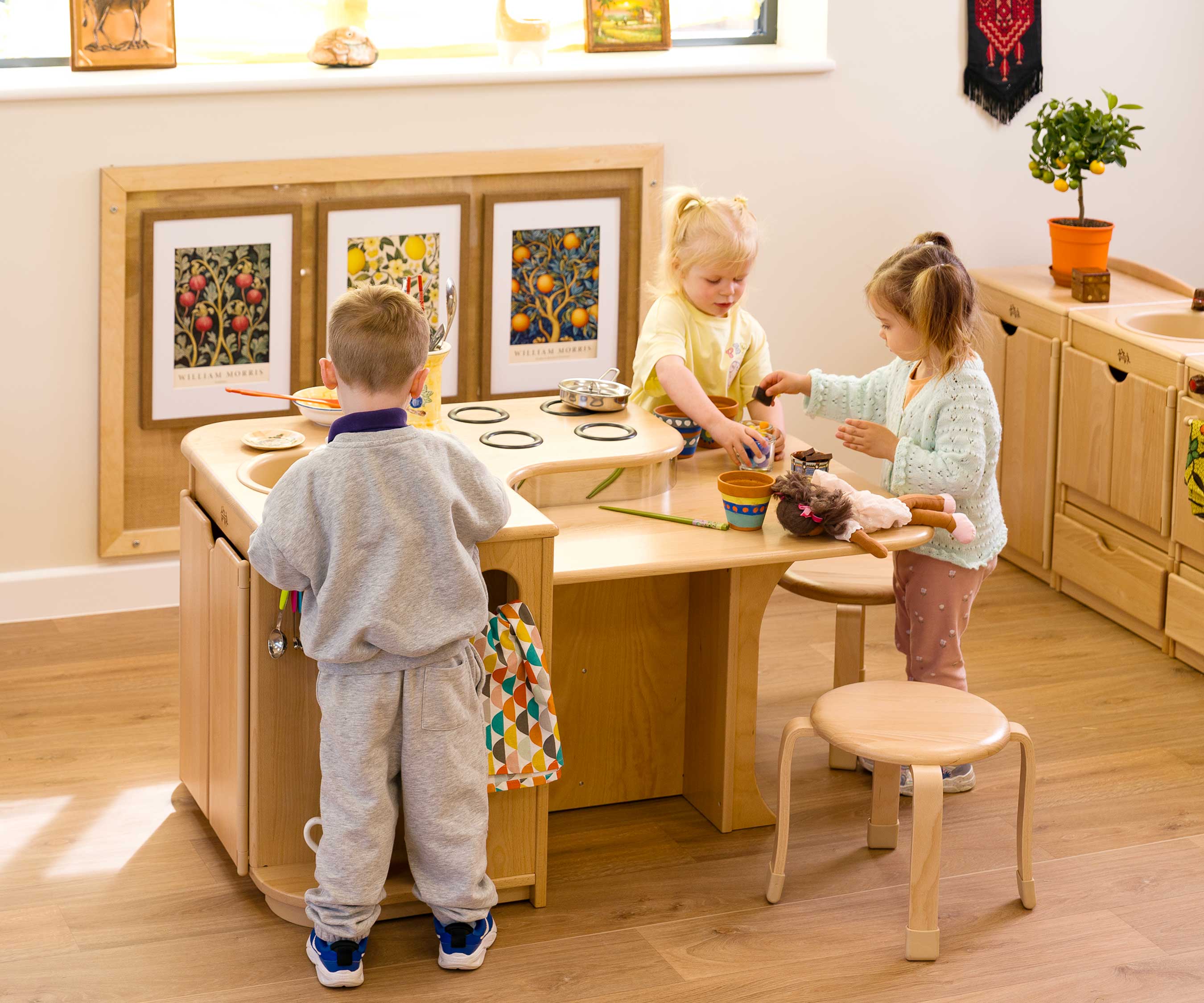 3 kids by high kitchen island
