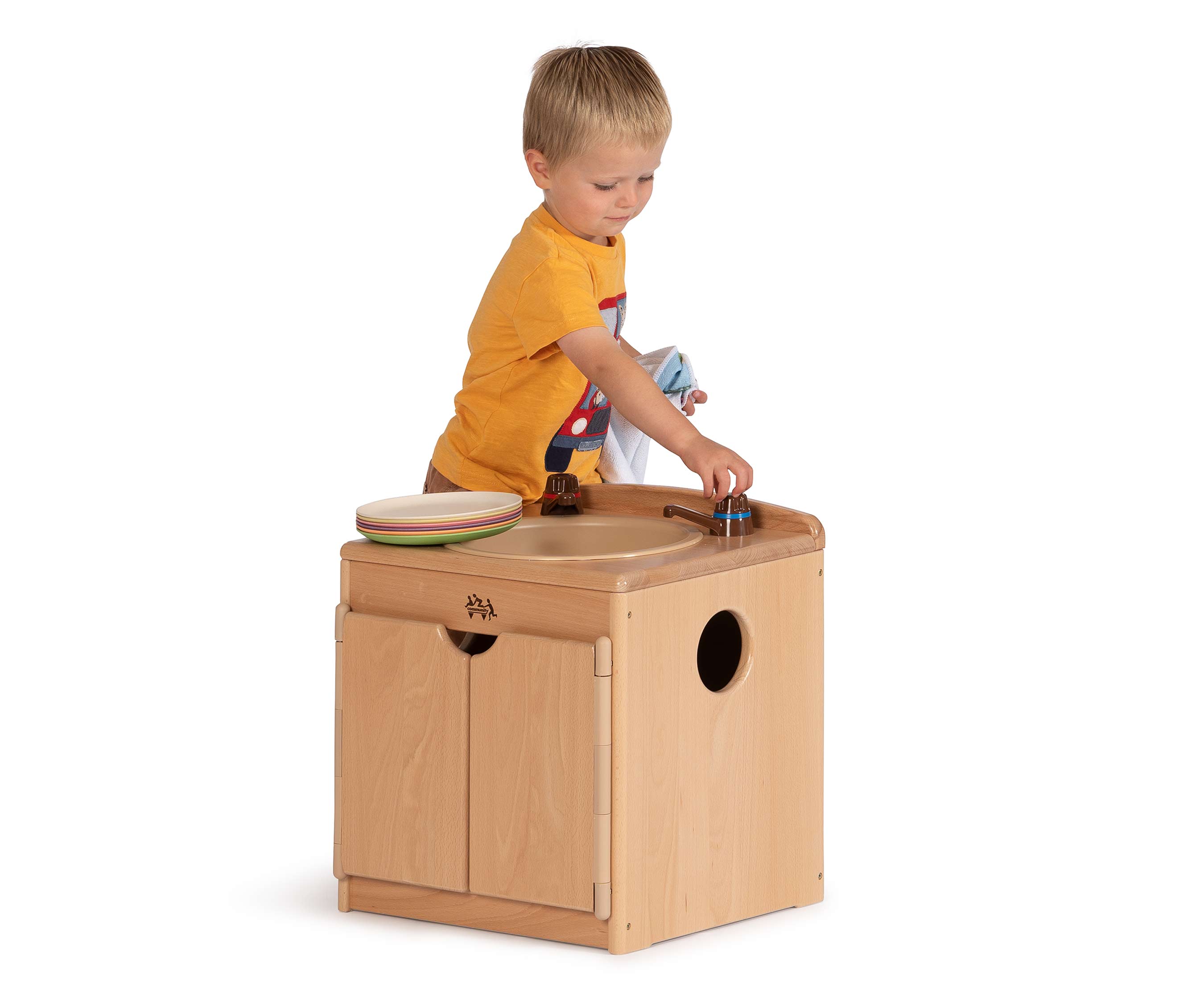 Child playing with sink
