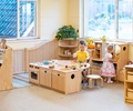 Kitchen island made from solid wood with two children playing