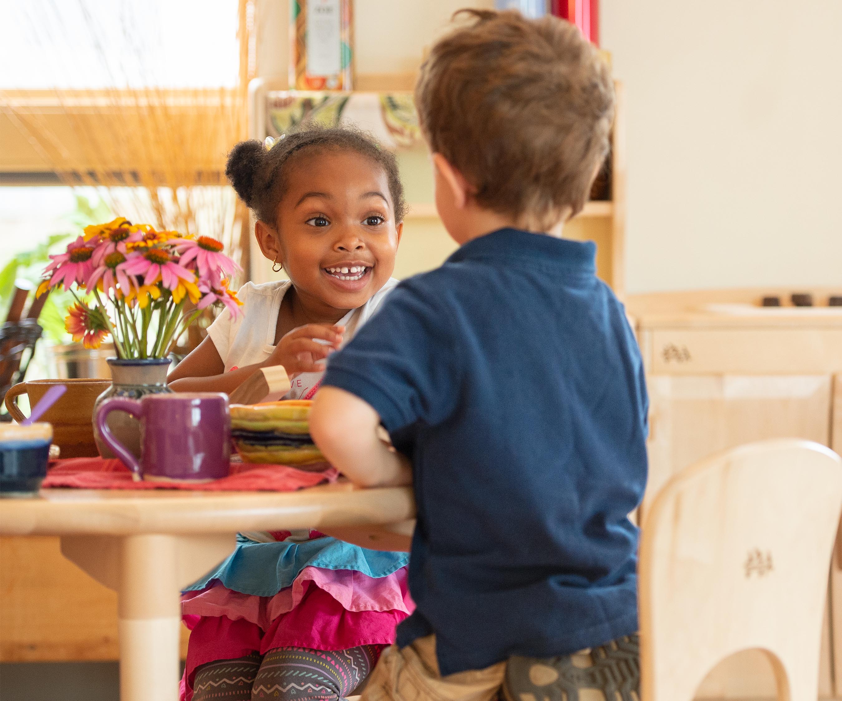 Two children at the play table