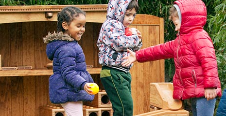 Children playing in front of an Outlast storage unit