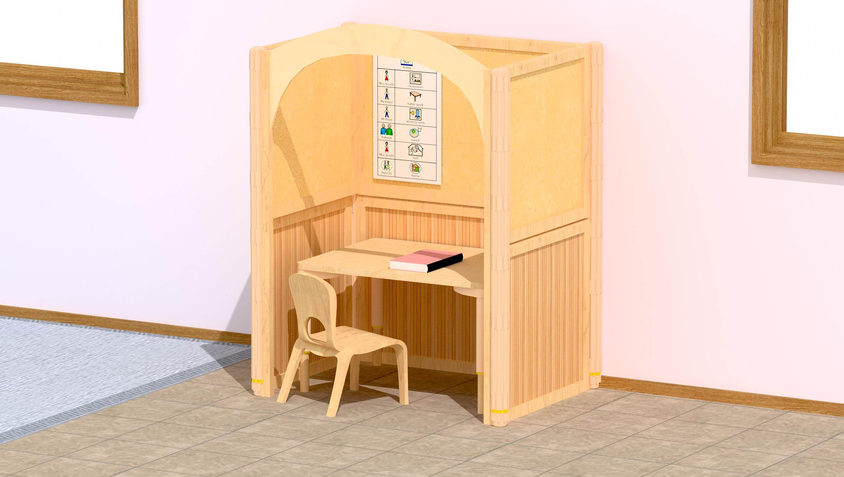 Nursery Compact 1 workstation with a small wooden chair and a book on the desk, against a pink wall.